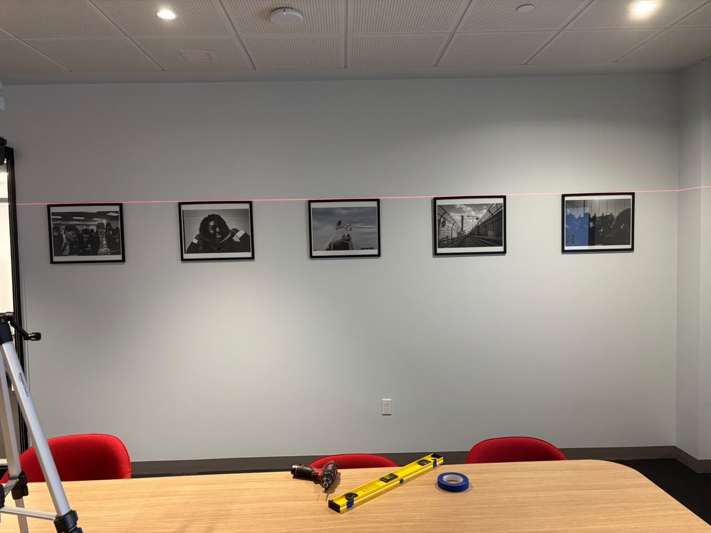 A precisely aligned row of framed photographs
